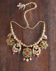 Handcrafted gold polki tukdi necklace featuring a floral pendant, pearl clusters, ruby and emerald accents, nath and fish motifs, fungar detailing, and traditional patwa threadwork.