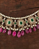 Aesha Necklace in gold featuring emerald-set square motifs framed in brilliant-cut diamonds, pearl strands, and a cultured pearl and ruby drop fringe - handcrafted fine jewellery.