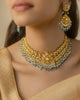 Apara polki bridal necklace with emeralds and pearls worn by a model