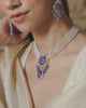 Model wearing the Eza tanzanite necklace with diamonds and cultured pearls