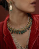 Kashi Hasli rigid gold torque necklace with hand-enamelled red and green floral vine, Polki diamond blooms, cultured pearl border, and graduating emerald drops