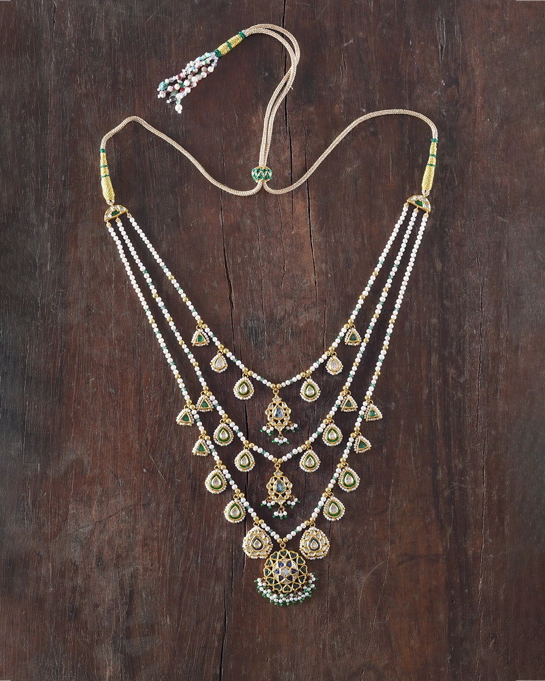 Keerat teenlada gold necklace with emeralds pearls and gemstone details