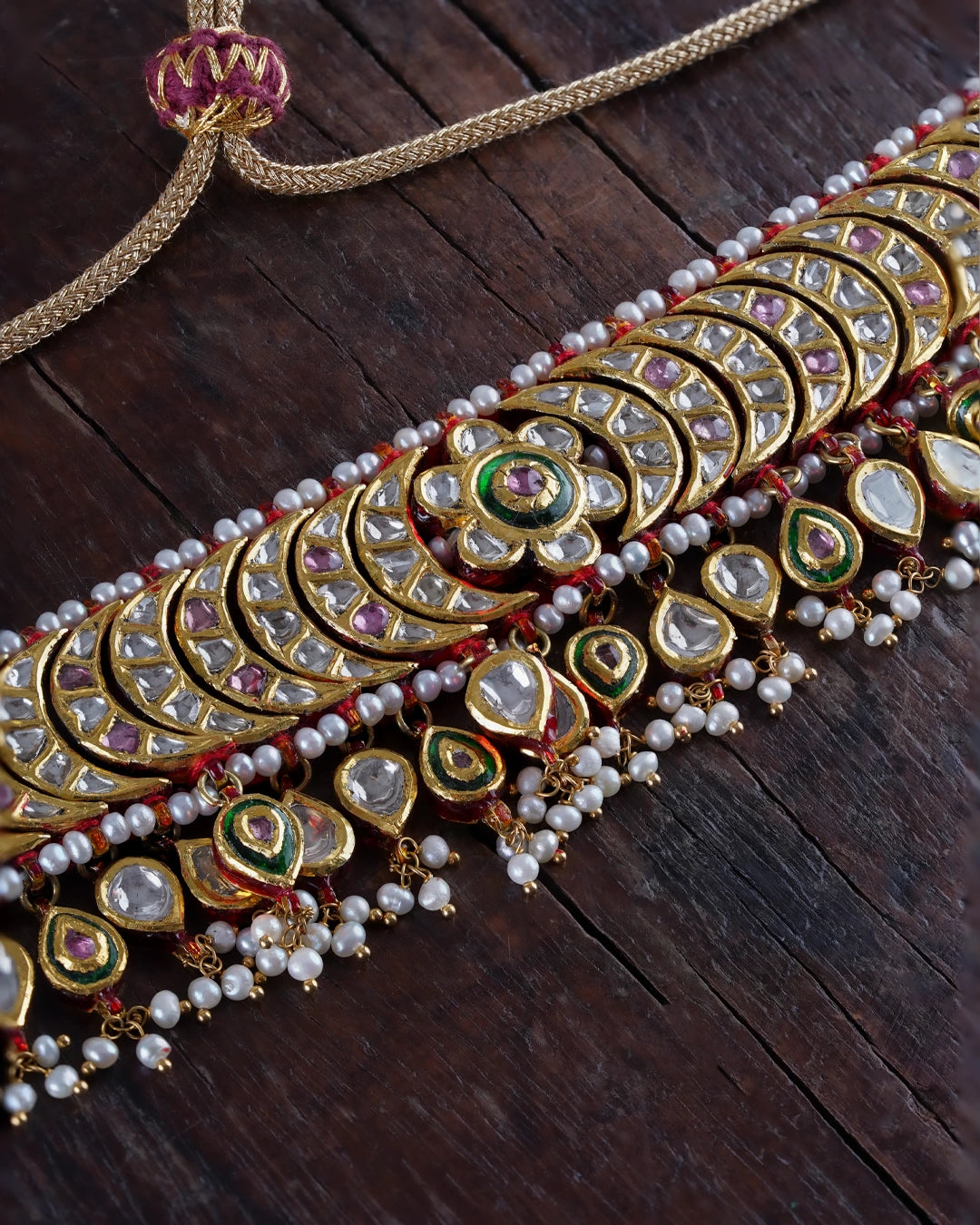 Lasya bridal choker necklace with uncut diamonds, pearls, red enamel and tourmaline in gold.