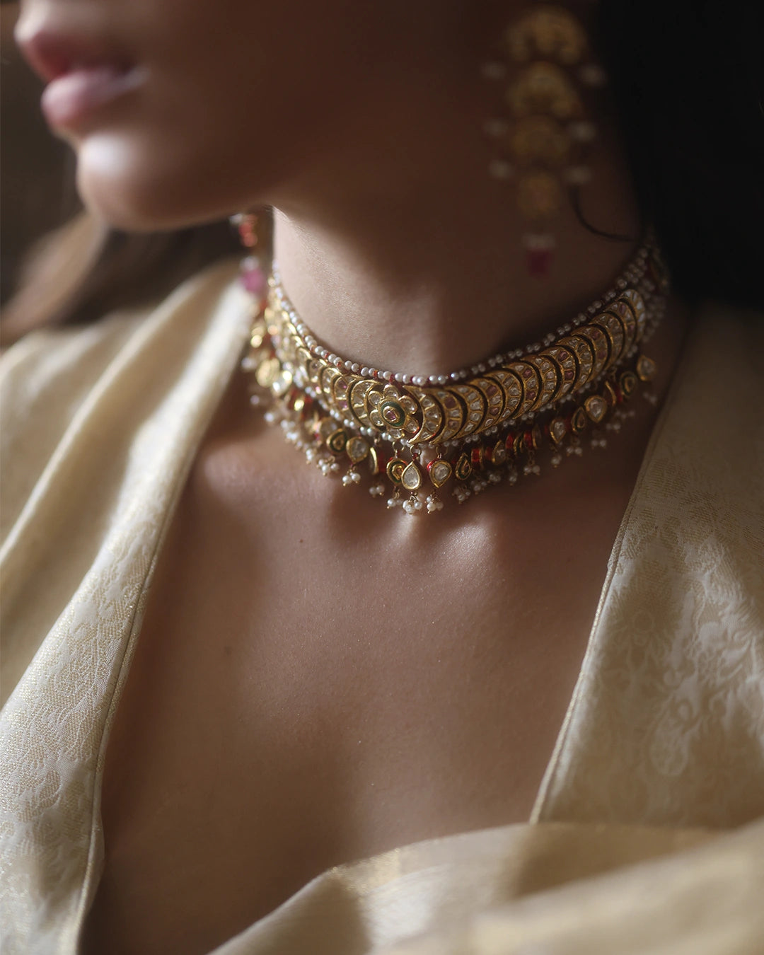 Lasya bridal choker necklace with uncut diamonds, pearls, red enamel and tourmaline in gold