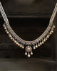 Mukta Necklace in gold featuring a natural brilliant-cut diamond framework with cascading cultured pearl drops and a suspended central pendant