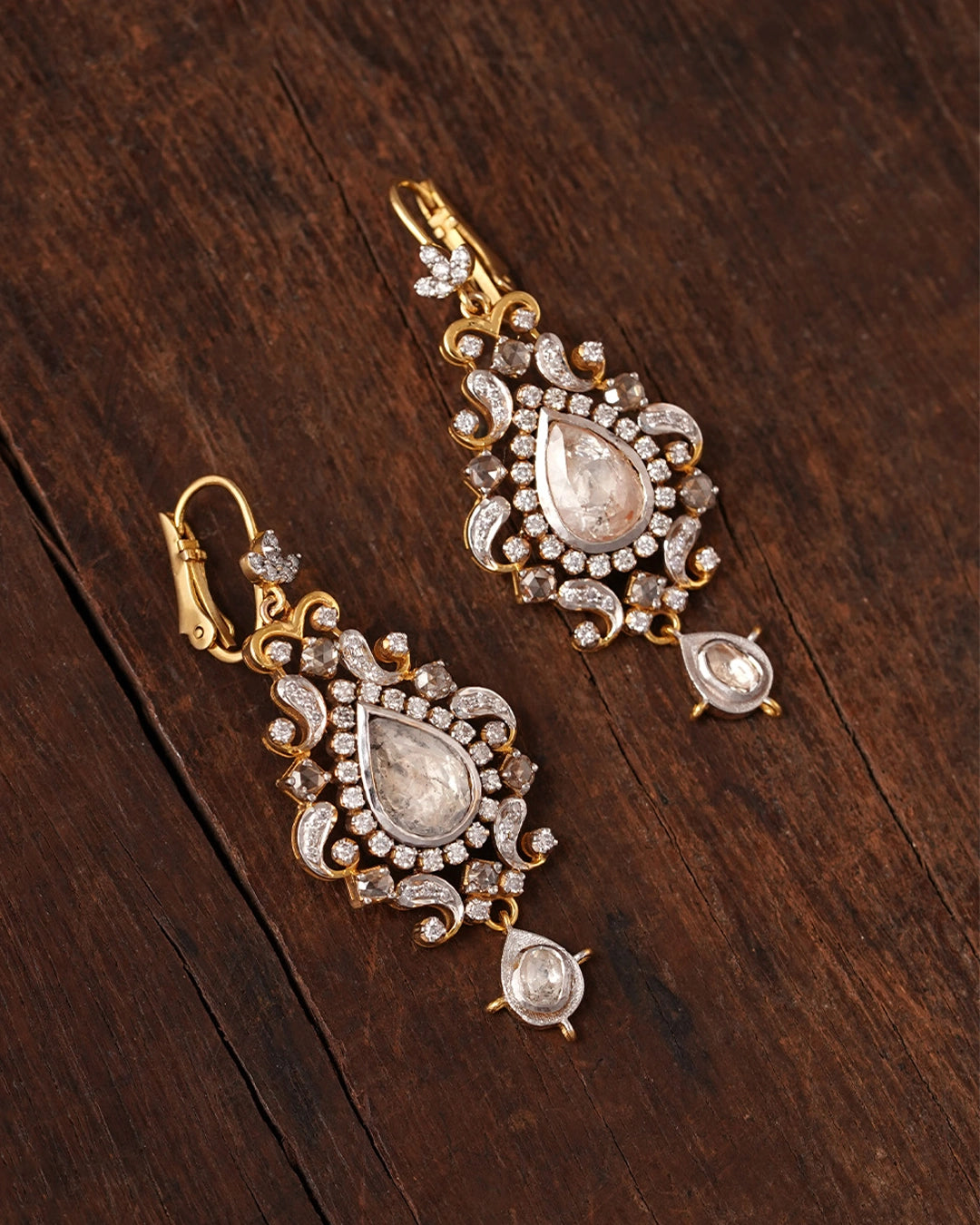 Naaz Earrings in gold featuring a drop-shaped natural rose-cut diamond center, surrounded by a brilliant-cut diamond halo and intricate rose-cut and brilliant-cut diamond detailing.