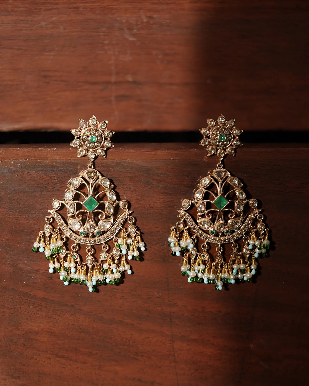 Gold Nehir Earrings with rose-cut diamonds, emerald accents, and pearl drops