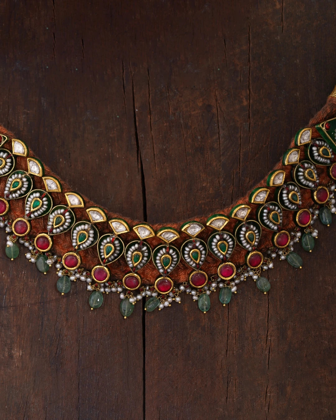 gold polki and emerald choker necklace