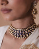 Vivir gold Polki collar necklace with graduated uncut diamonds and cobalt blue enamel borders, worn close to the throat
