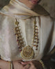 Model wearing Yug Polki Kundan necklace with pearls and tourmaline drops
