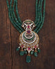 Close-up of the Zyar Necklace crescent pendant showing natural brilliant-cut diamonds, glass-filled ruby, green enamel work, and cultured pearl drops - intricate heritage craftsmanship